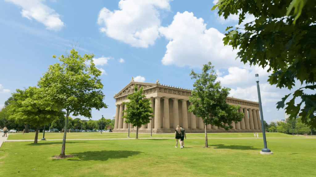 Beautiful view of the Nashville Parthenon surrounded by Centennial Park’s green lawns, walking paths, and mature trees