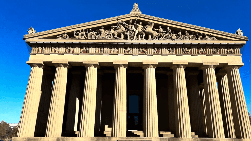 Vintage black-and-white photo of Harvey’s Nativity Scene displayed in front of the Nashville Parthenon during Christmas with classical columns