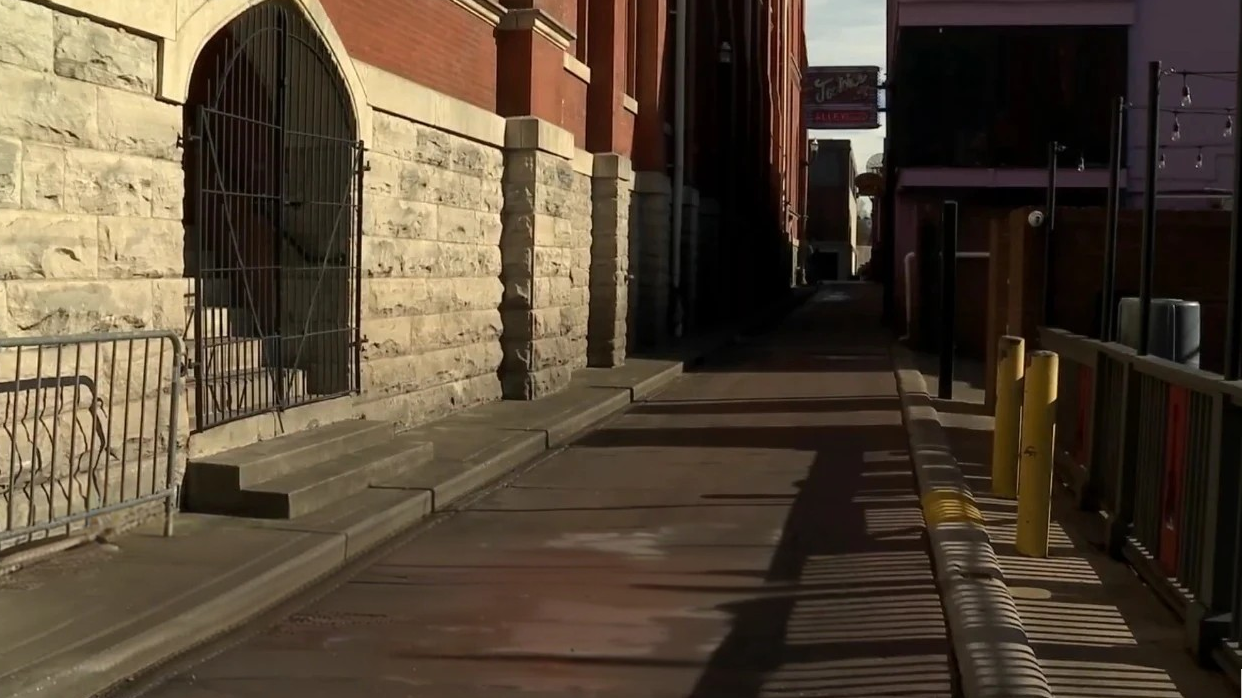 Stone archway and metal railing at Ryman Alley behind the historic Ryman Auditorium in Nashville
