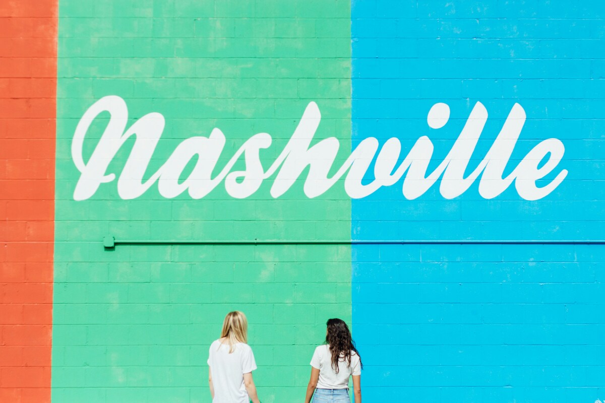 Iconic Nashville mural with colorful stripes and cursive lettering—a favorite Instagram spot for visitors and locals.
