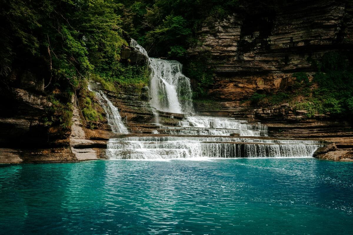 Stunning Hidden Nashville waterfall cascades over limestone in to turquoise waters, a natural Music City gem