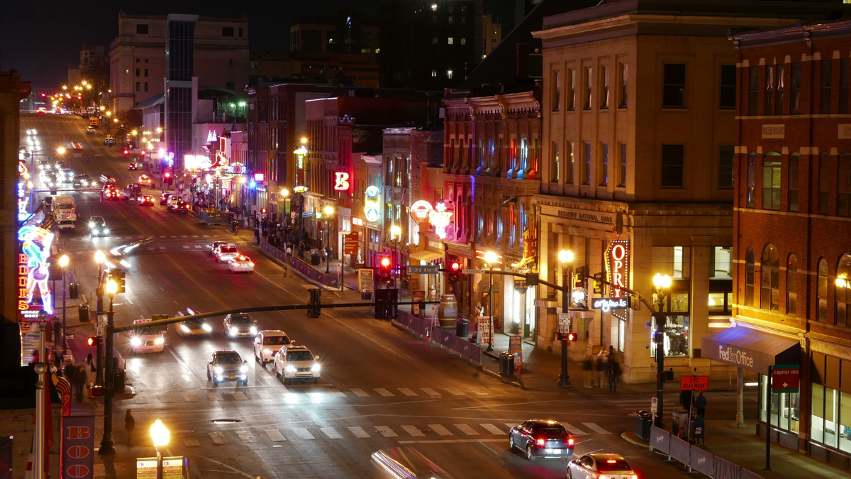 Nashville's vibrant nightlife! Bustling Broadway with neon signs & traffic, but bars close eventually. What time do Nashville bars close?