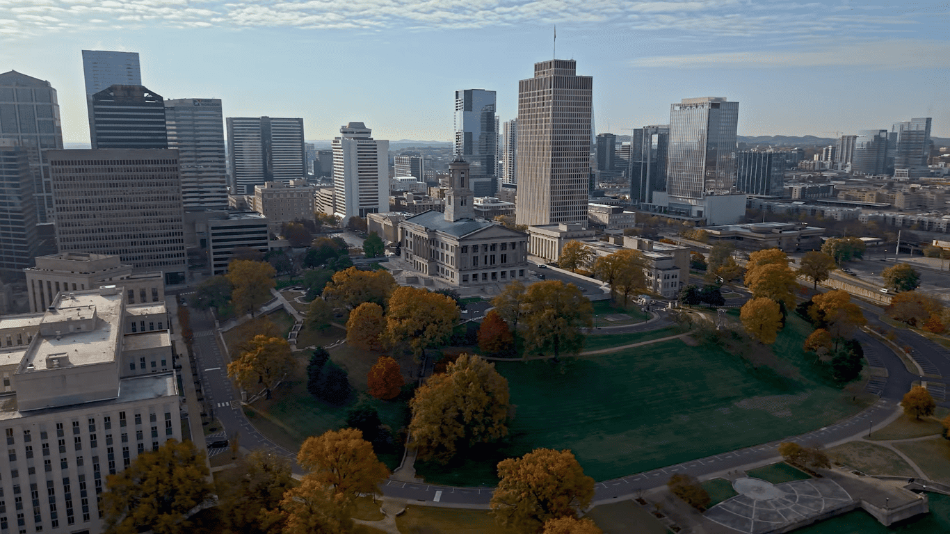 Nashville skyline view showcasing state capitol building, downtown skyscrapers and autumn trees for 3-day trip exploration