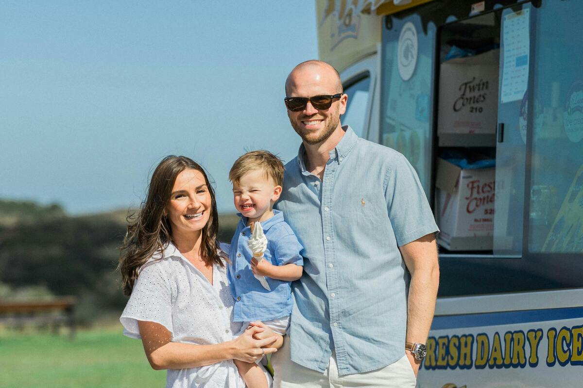 Happy family enjoys ice cream from a food truck on a sunny day in Nashville’s countryside