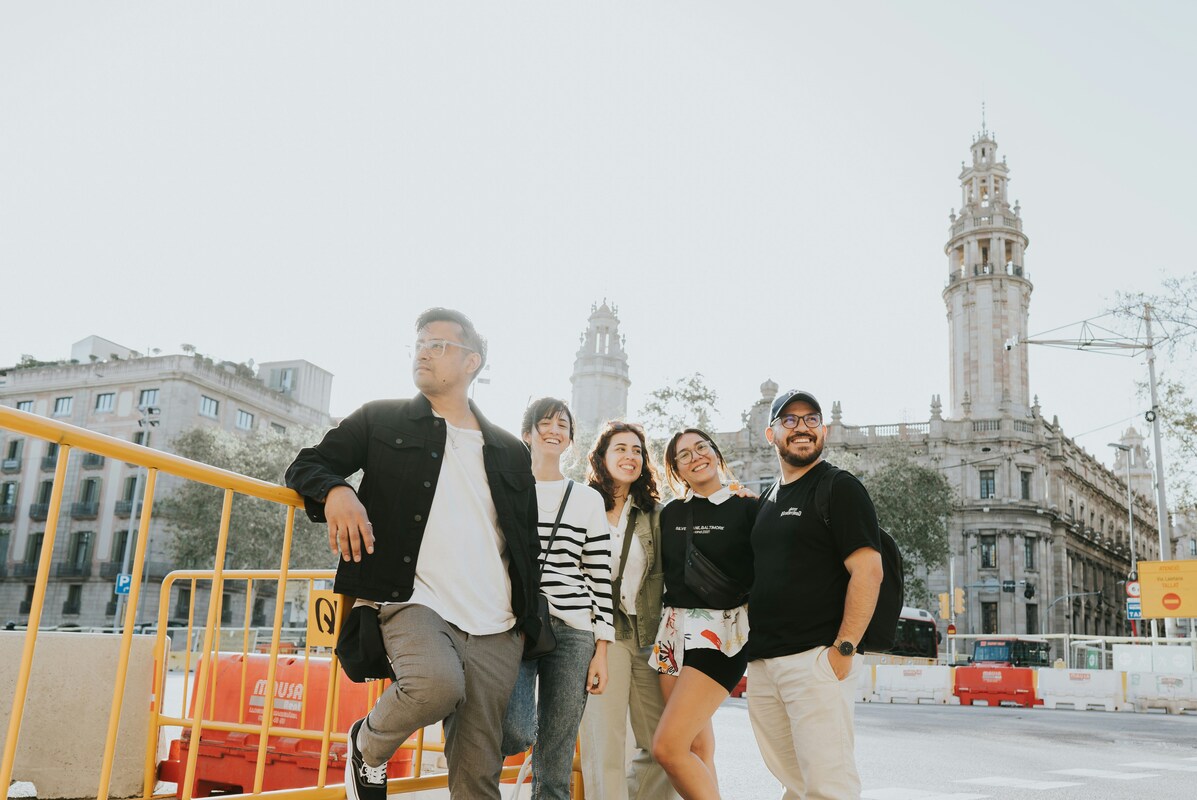 Group of travelers posing together in front of stunning historic architecture during their downtown Nashville exploration
