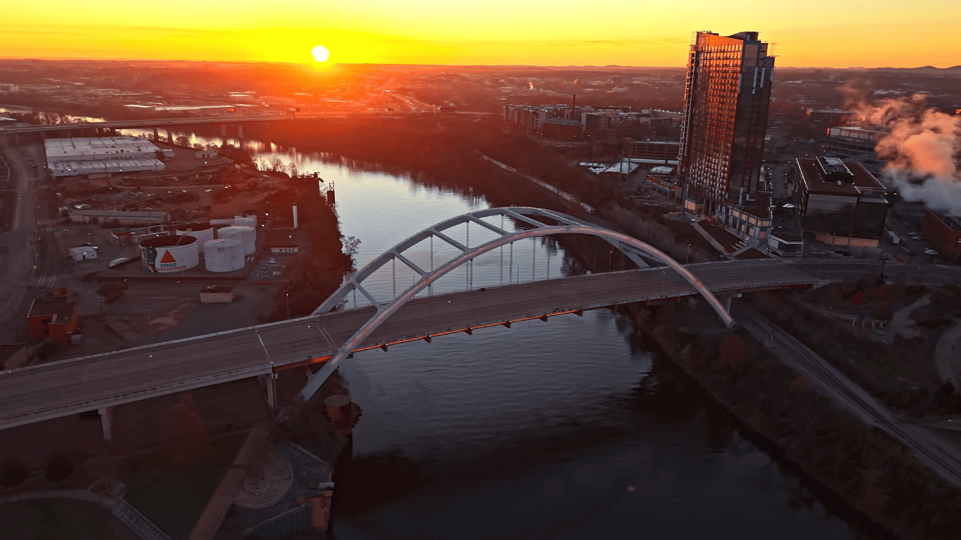 Scenic Cumberland River with Korean War Veterans Bridge at sunset, highlighting Nashville's waterfront beauty during 3-days