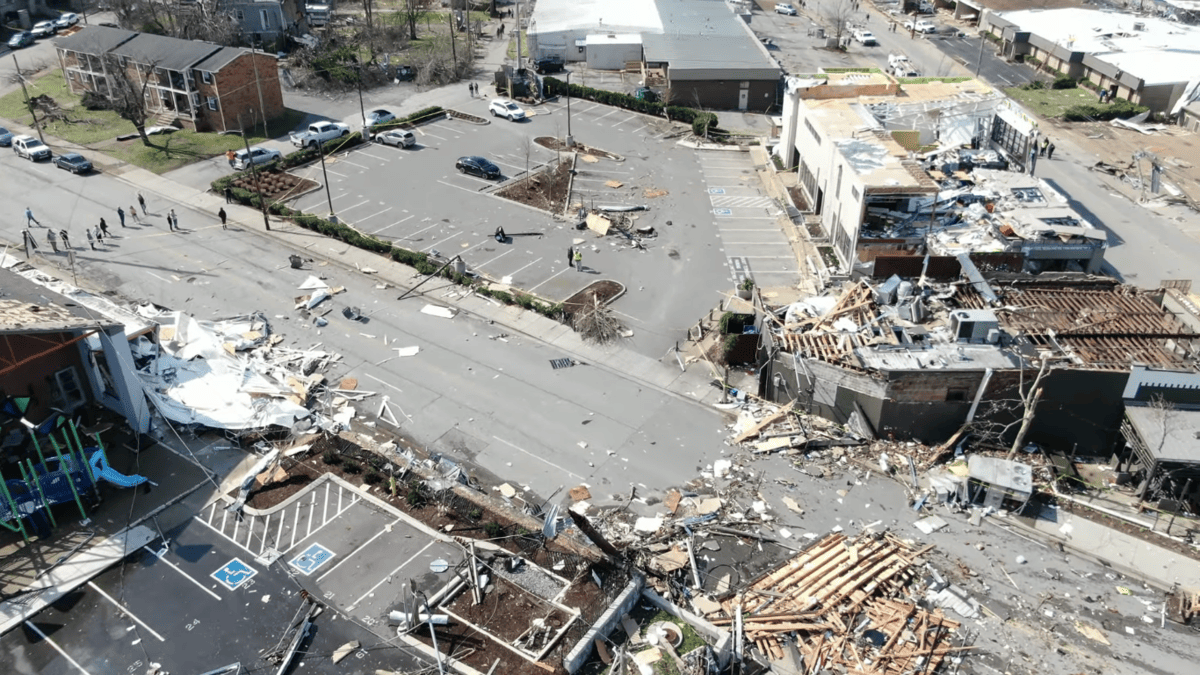 East Nashville History: Modern aerial view of tornado damage with destroyed buildings and scattered debris across streets