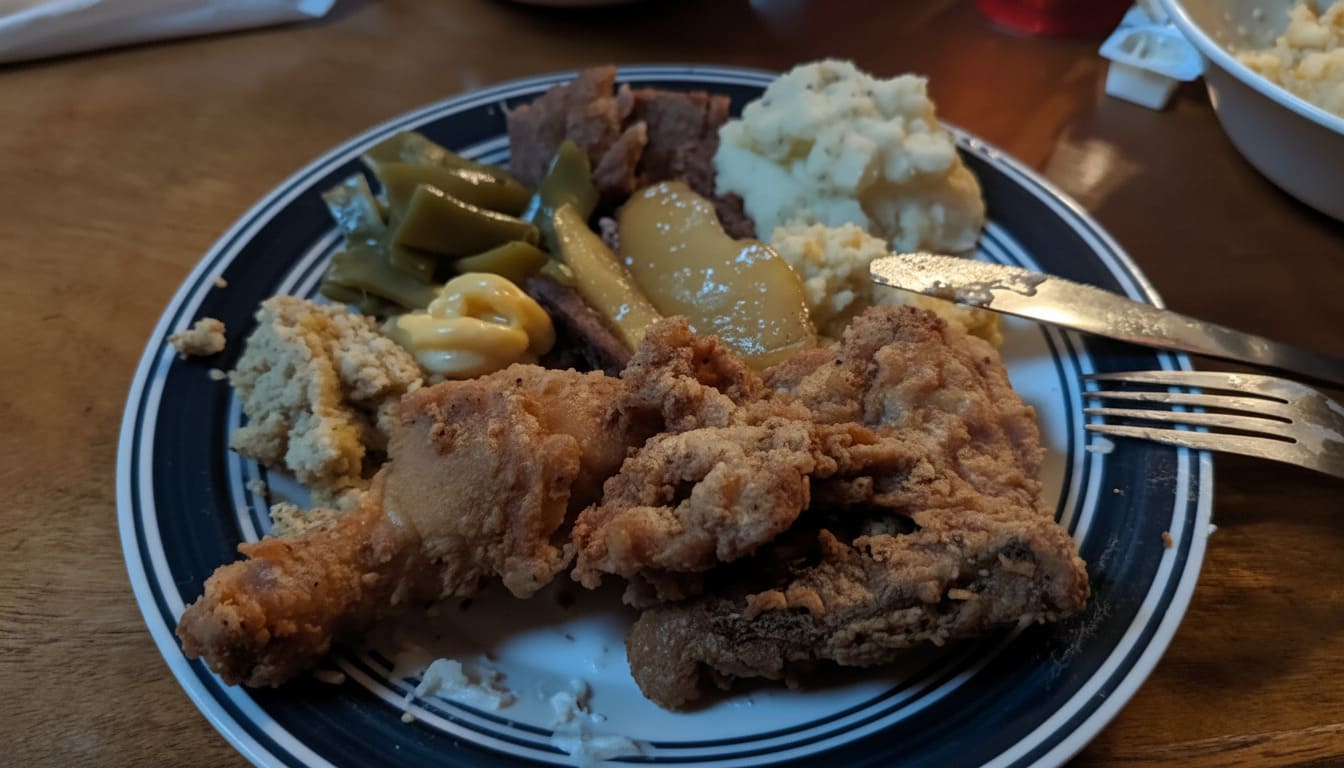 Priya enjoying crispy fried chicken with southern sides at Monell's for late night time in nashville