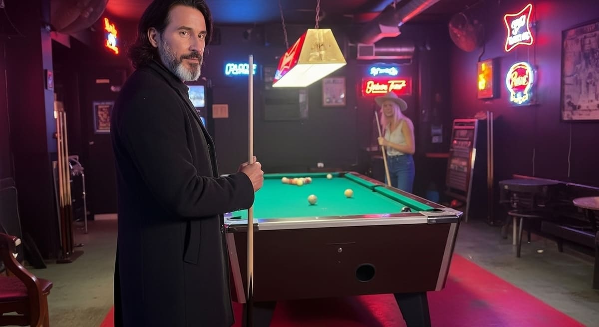Ethan playing pool with friends at dive bars in Nashville under neon lights at The Underdog bar