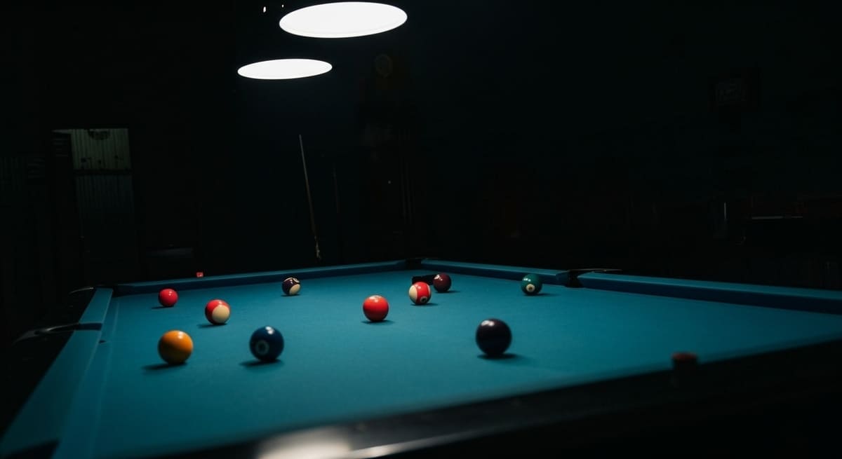 Racked colorful pool balls under dramatic lighting at Nashville bars that have pool tables for nightlife